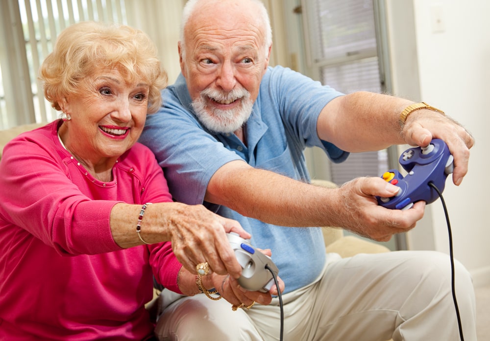 Elderly people with technology gadget, play video game. Seni